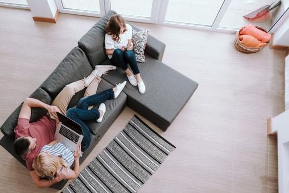 A Family Plays On Their Devices At Home.